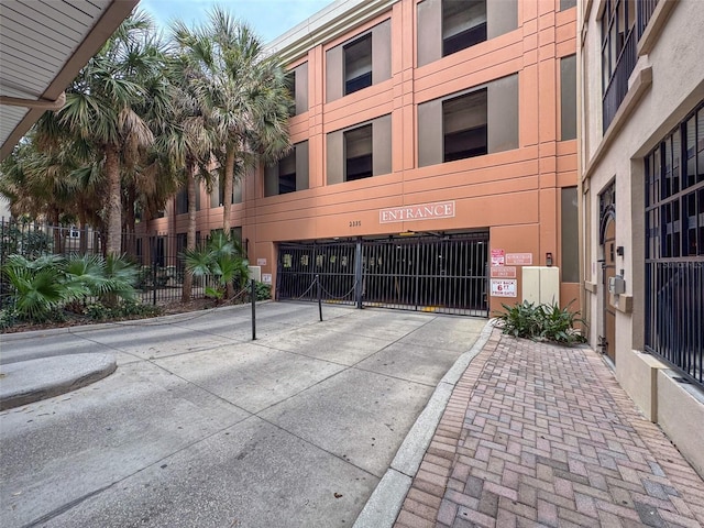 view of building exterior featuring fence