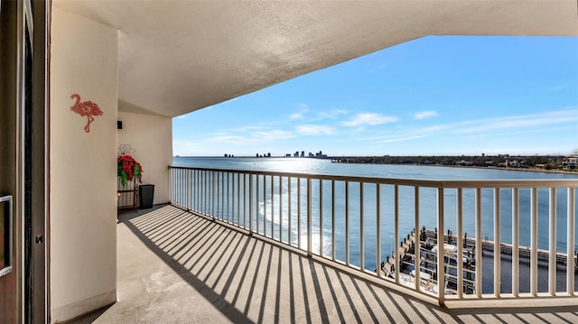 balcony featuring a water view