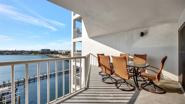 balcony featuring a water view