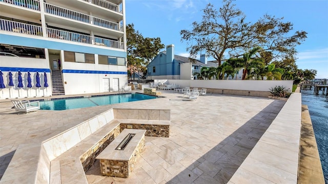 community pool with a patio