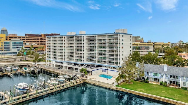 view of property with a water view and a city view