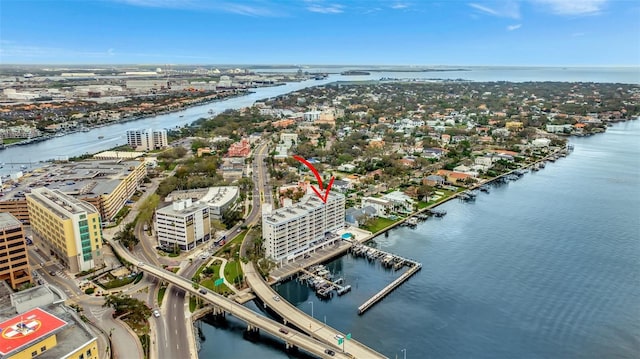 birds eye view of property with a water view and a view of city