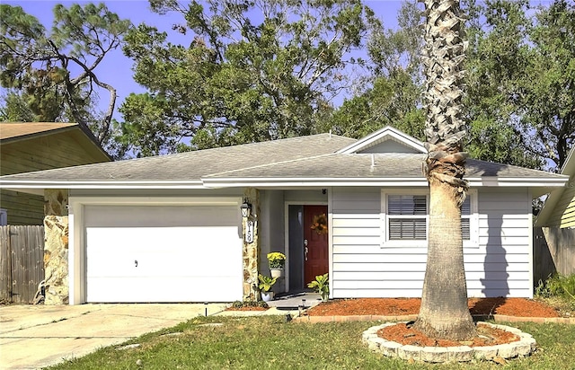 ranch-style home featuring a garage, driveway, roof with shingles, and fence