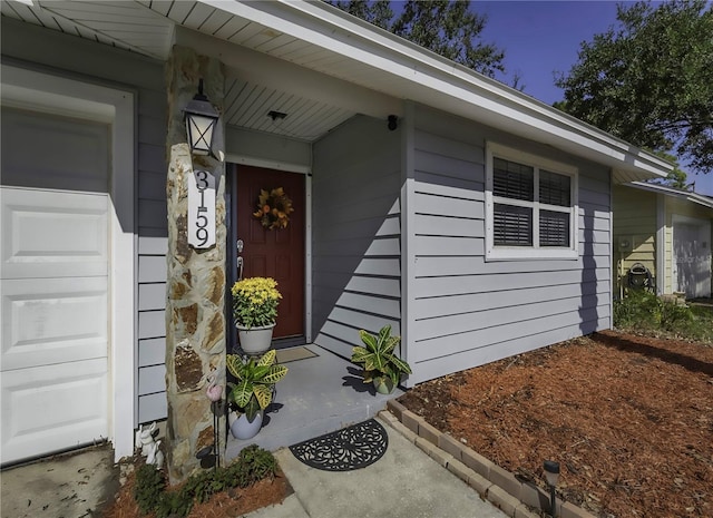 property entrance with an attached garage