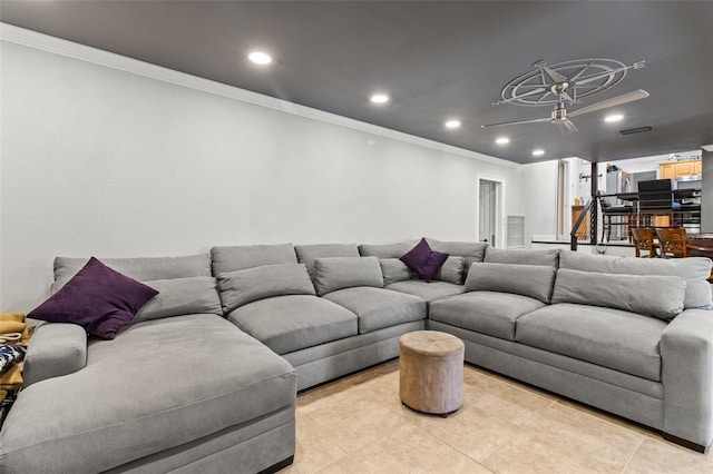 living room with crown molding, light tile patterned floors, and recessed lighting