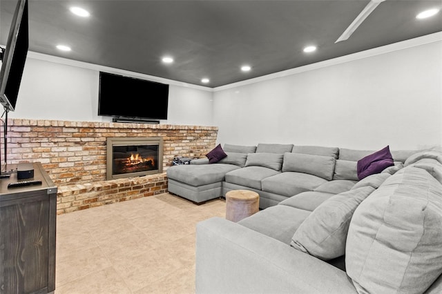 living area with a brick fireplace, ornamental molding, and recessed lighting