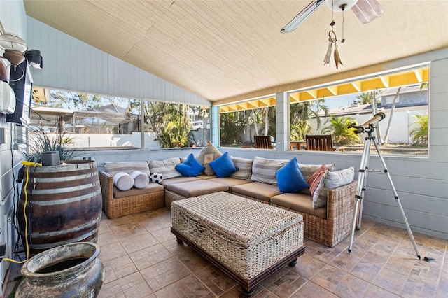 view of patio / terrace with an outdoor living space and a ceiling fan