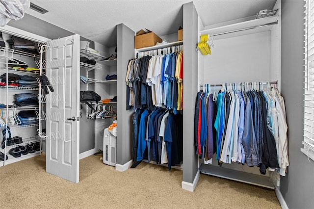 spacious closet featuring carpet floors and visible vents