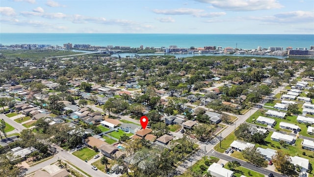 birds eye view of property featuring a water view and a view of city