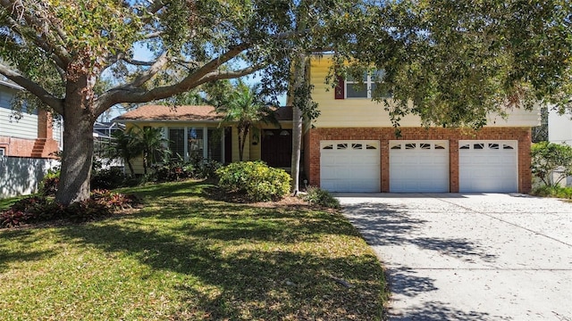 view of front of home featuring driveway, brick siding, a front lawn, and an attached garage