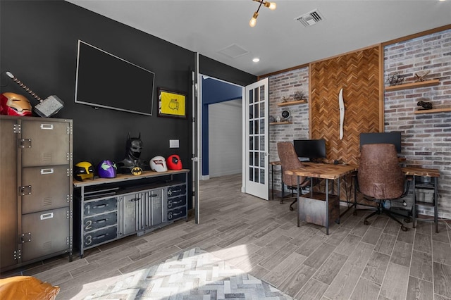 office area with french doors, visible vents, and wood tiled floor