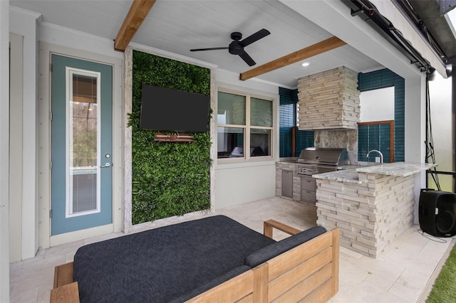 view of patio / terrace featuring an outdoor kitchen, a grill, and a ceiling fan