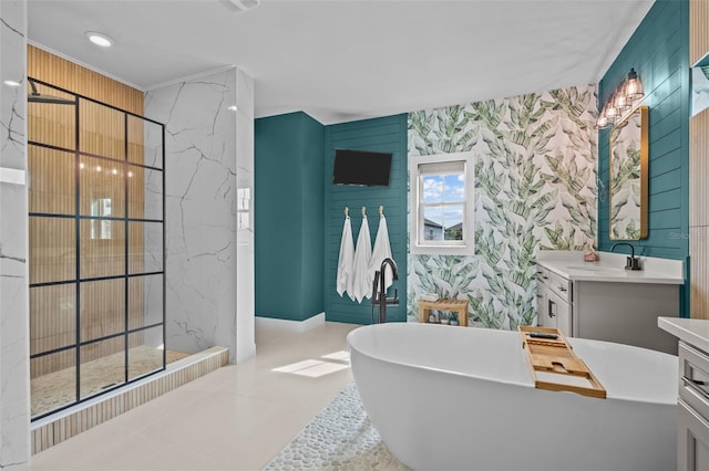 full bath with a freestanding tub, walk in shower, vanity, and wallpapered walls