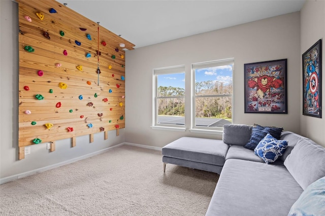 sitting room with carpet flooring and baseboards