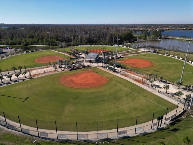 bird's eye view with a water view and view of golf course