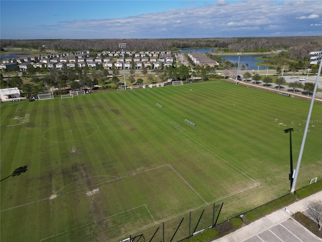 birds eye view of property with a water view and a residential view