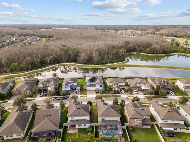 drone / aerial view featuring a water view and a residential view