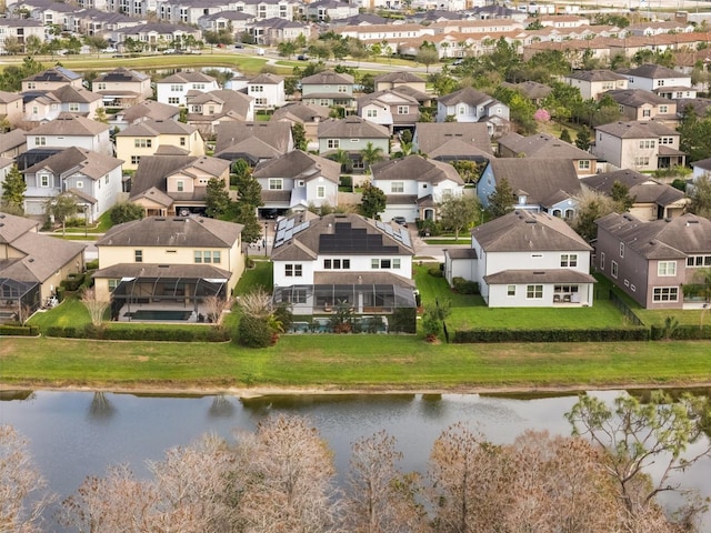 bird's eye view with a residential view and a water view