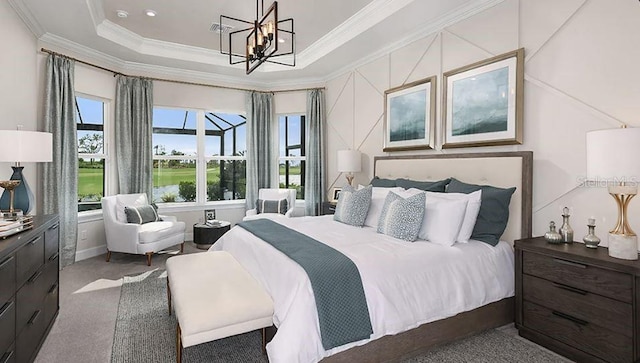 bedroom with a tray ceiling, dark colored carpet, crown molding, a notable chandelier, and recessed lighting