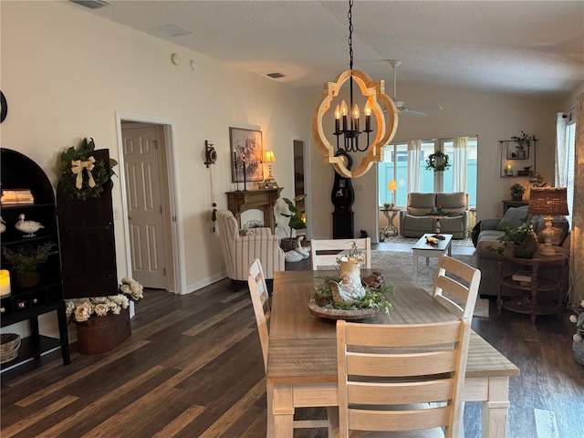 dining room with dark wood-style floors, visible vents, vaulted ceiling, and an inviting chandelier