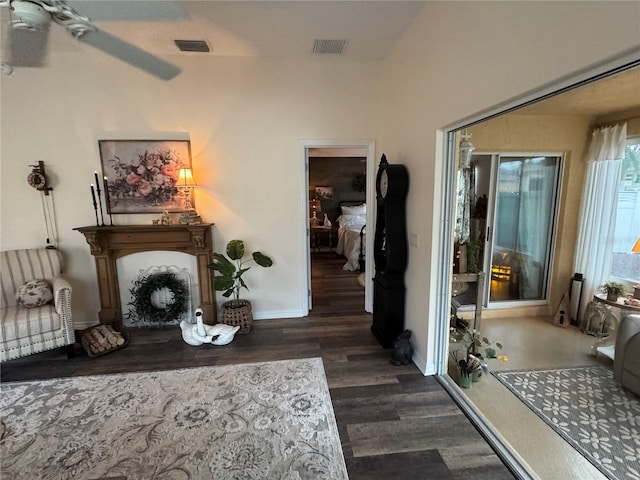 interior space featuring dark wood-style flooring, visible vents, and baseboards