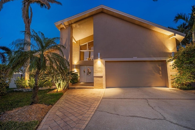 view of front of house featuring driveway and stucco siding