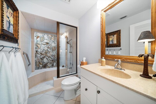 447 22nd St, Belleair Beach, FL 33786 - bathroom with visible vents, toilet, shower / bath combination with glass door, tile patterned flooring, and vanity