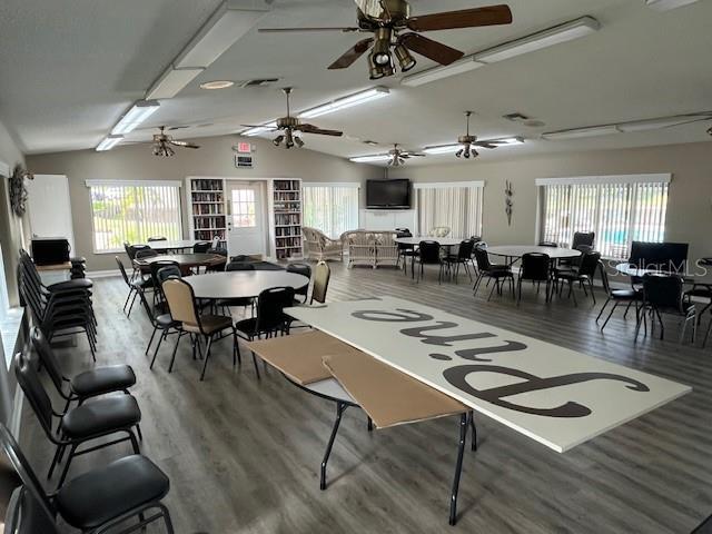 dining room featuring lofted ceiling and wood finished floors