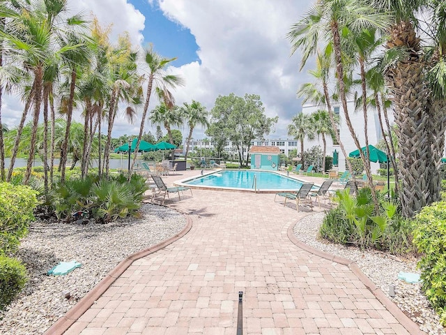 community pool featuring a patio area