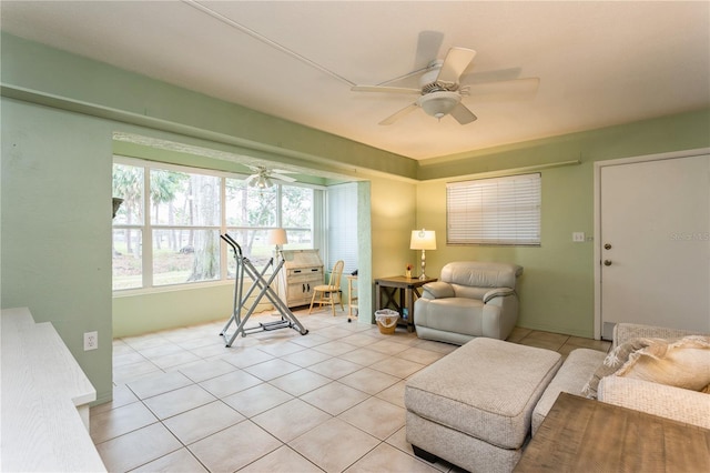 interior space with light tile patterned floors and a ceiling fan