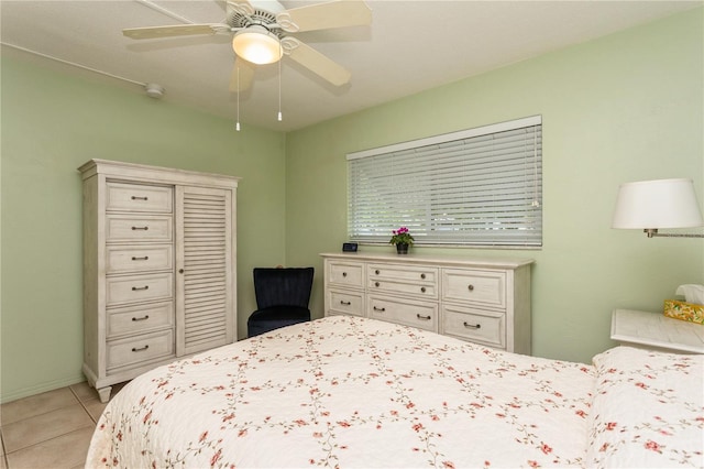 bedroom featuring ceiling fan and light tile patterned floors