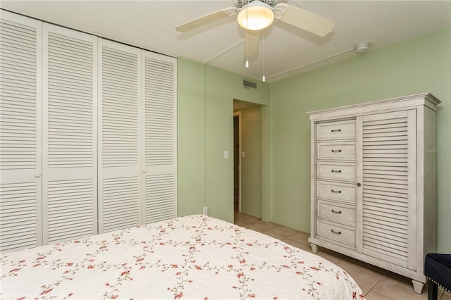 unfurnished bedroom featuring light tile patterned floors, ceiling fan, a closet, and visible vents