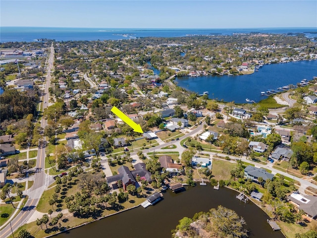 birds eye view of property with a water view and a residential view