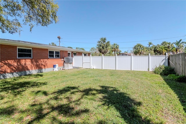 view of yard with a fenced backyard