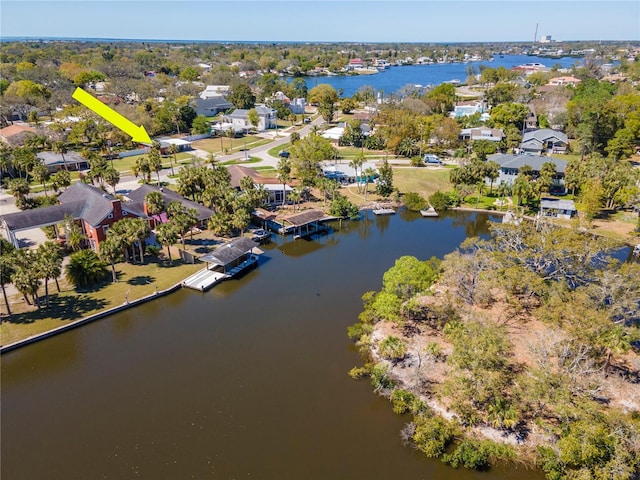 drone / aerial view featuring a water view and a residential view