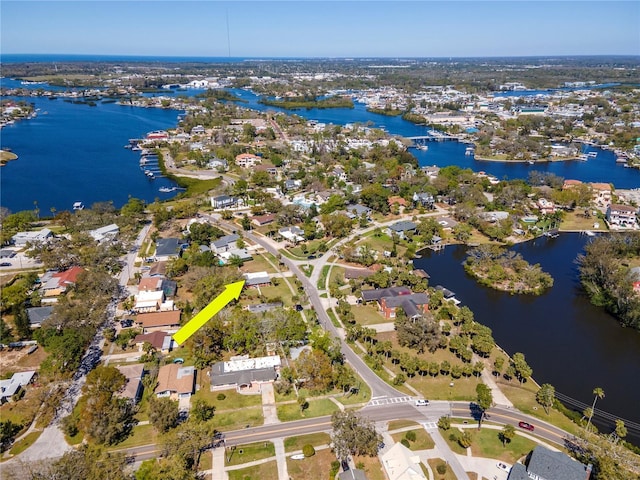 birds eye view of property with a water view and a residential view