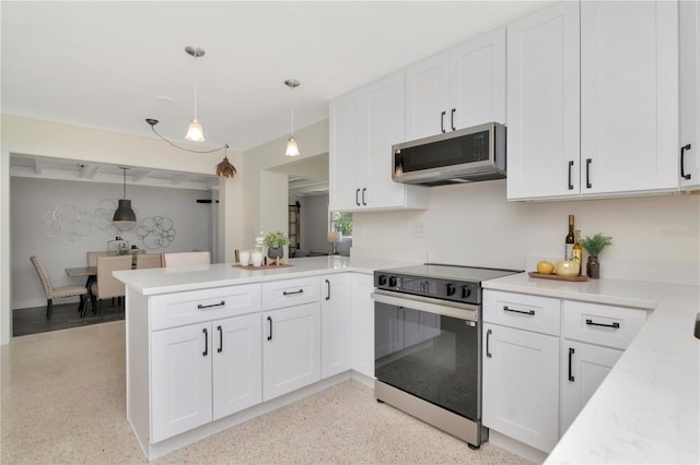 kitchen featuring a peninsula, range with electric cooktop, white cabinets, stainless steel microwave, and light countertops