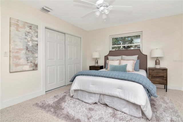bedroom with a closet, visible vents, baseboards, and a ceiling fan