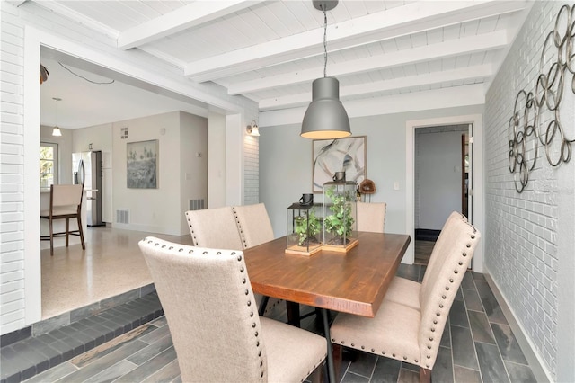dining area with wooden ceiling, baseboards, visible vents, and beam ceiling