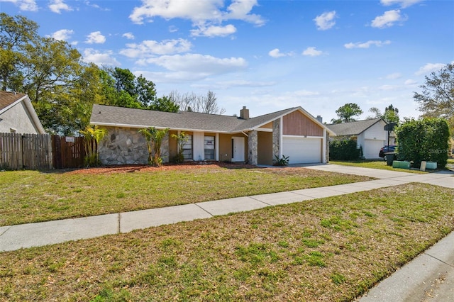 ranch-style home with driveway, a chimney, an attached garage, fence, and a front lawn