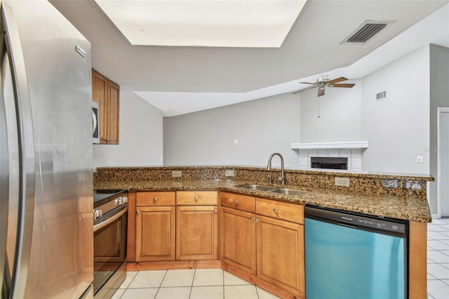 kitchen with stainless steel appliances, visible vents, a sink, and light tile patterned floors