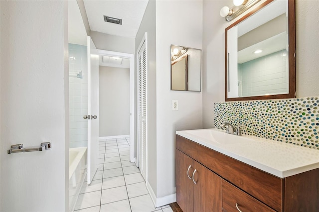 full bath with visible vents, decorative backsplash, vanity, tile patterned flooring, and baseboards