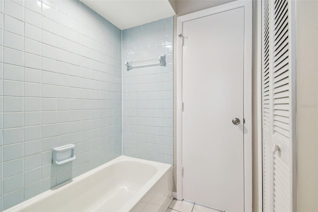 bathroom featuring tub / shower combination and tile patterned floors