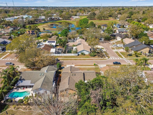 birds eye view of property featuring a water view and a residential view