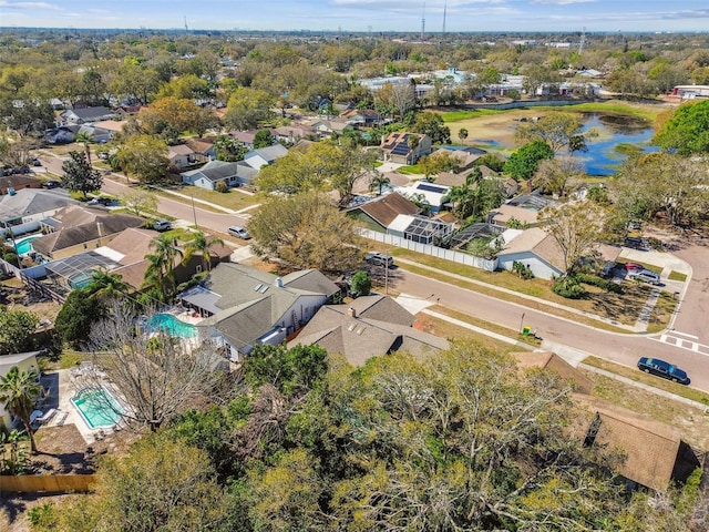 birds eye view of property featuring a water view and a residential view