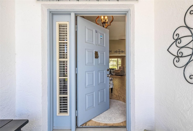 entrance to property with stucco siding