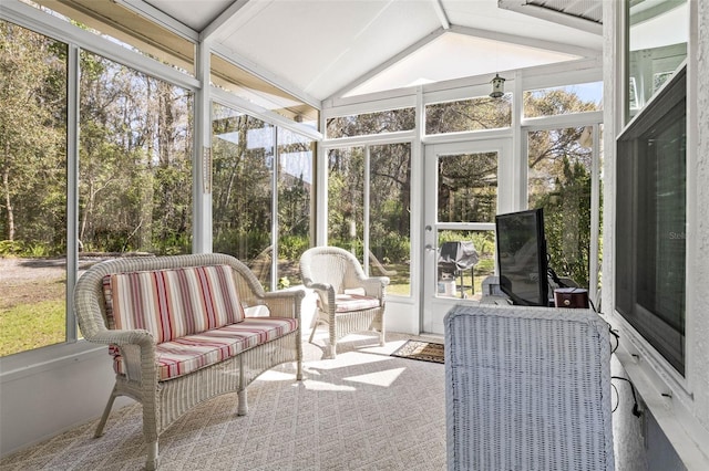 sunroom featuring lofted ceiling