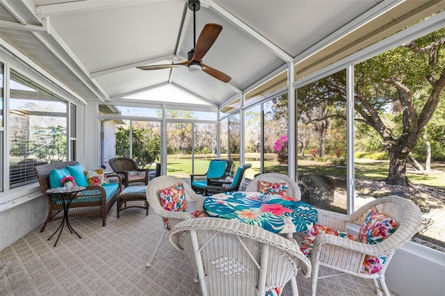 sunroom with lofted ceiling and ceiling fan