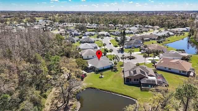 bird's eye view with a water view and a residential view