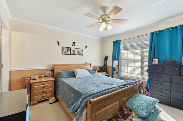 bedroom with light colored carpet, crown molding, a textured ceiling, and ceiling fan